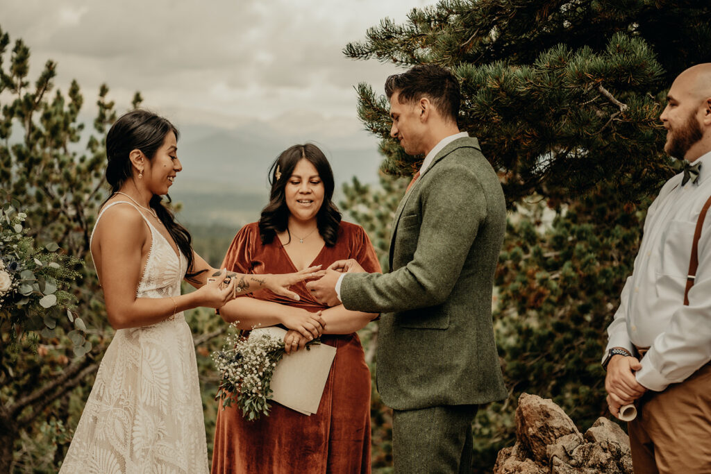Micro wedding ceremony at Panorama Point, Golden Gate Canyon Park. Ring Exchange