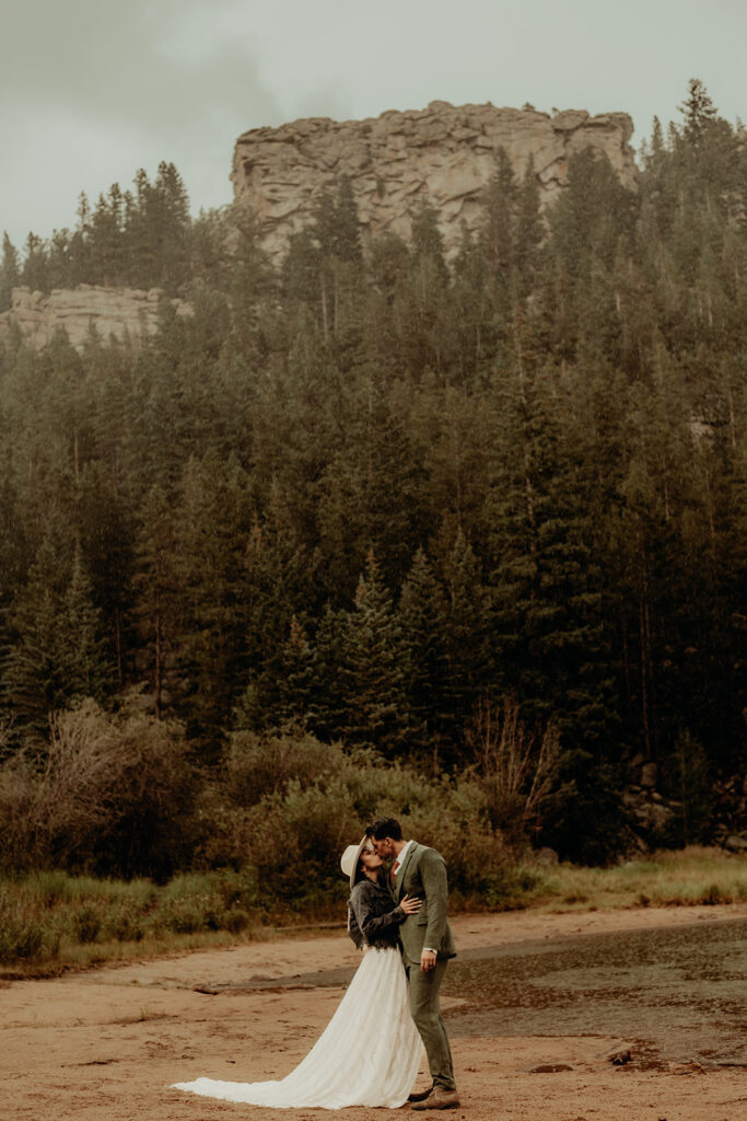 Micro wedding ceremony at Panorama Point, Golden Gate Canyon Park. Rainy day newly wed photos