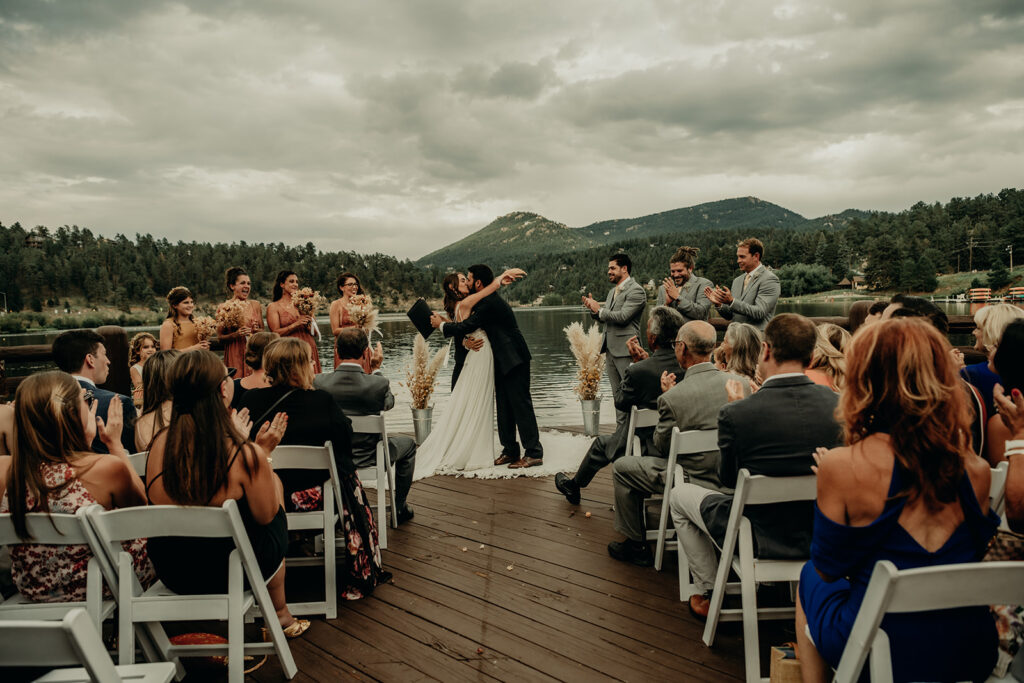 The Evergreen Lake ceremony site on an August summer evening with a the mountain and lake backdrop for your guests to ooo and ahh over.