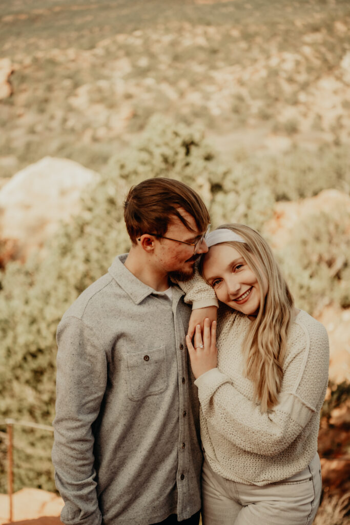 Nick admiring Callie as she leans up against him showing off her ring at the Garden of the Gods