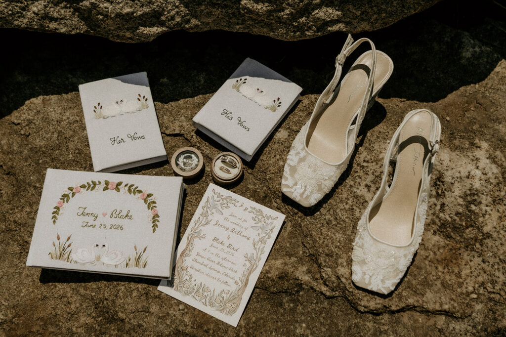 Detail shots of brides laced shoes, his and her vow books with birds sewn on them (their last name is BIRD) accompanied by their rings and invintations. 