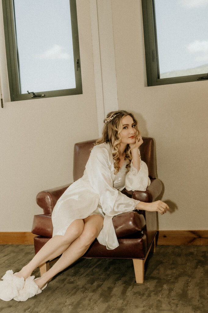 brides getting ready portrait, slippers, robe and all with the hair and makeup all done