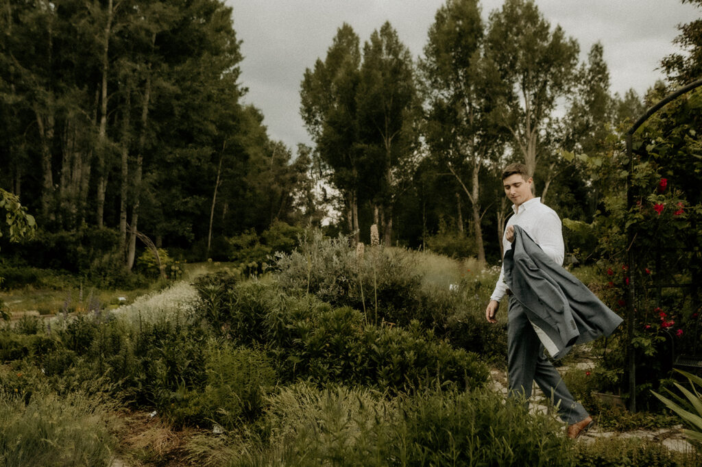groom walking as model at Yampa River Botanic Gardens