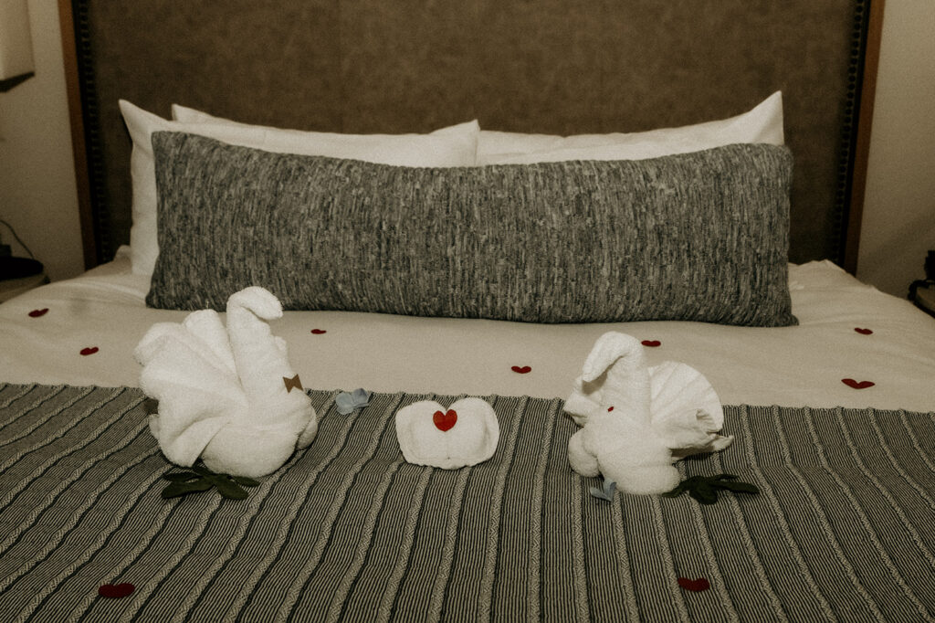 Steamboat Grand decorated the bride and grooms room with a little extra love of swan towels and heart confetti 