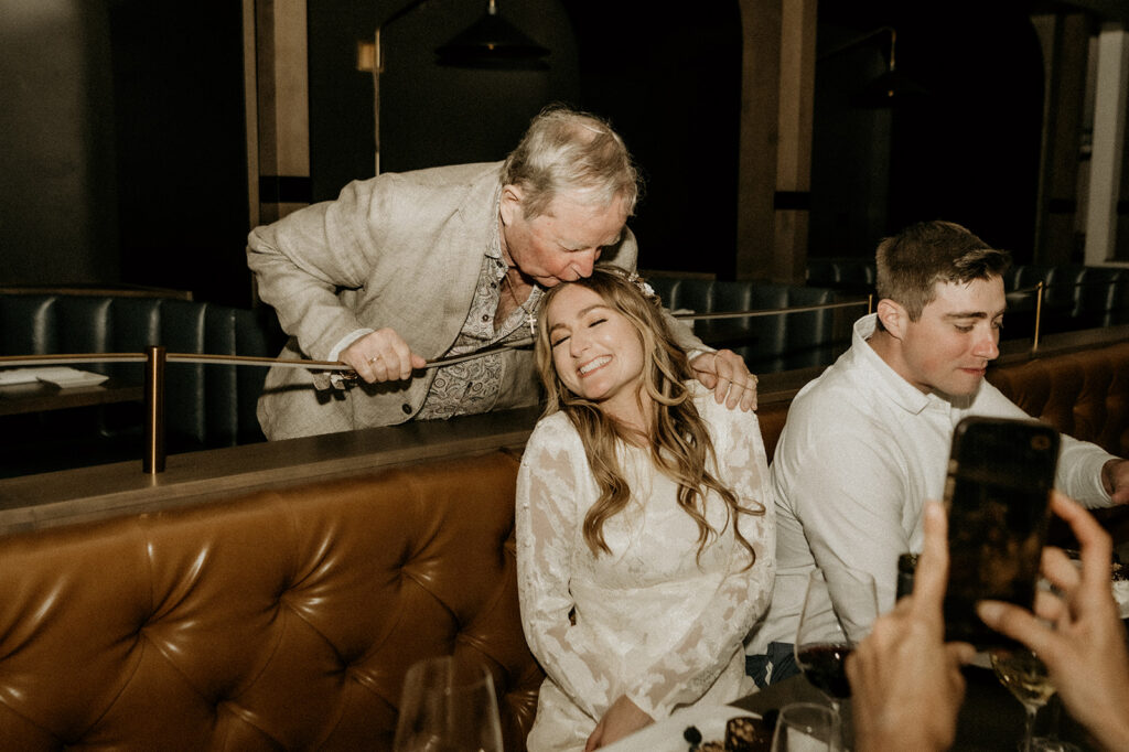 grandpa came on over to share some love and give the bride a kiss. moment captured forever. CHECK